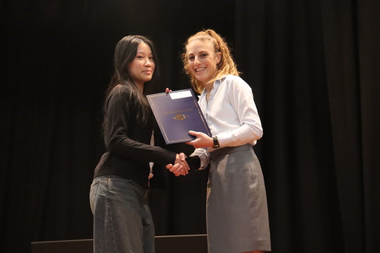 Student receiving award at High Achievers Assembly